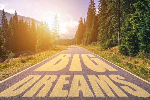 Dream Big written on the road to your dreams 