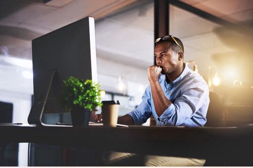 man concentrating on laptop