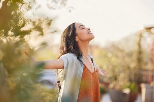 woman happy with arms out