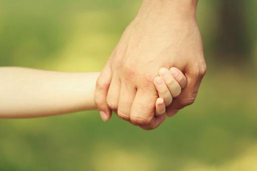 adult and Childs hand holding