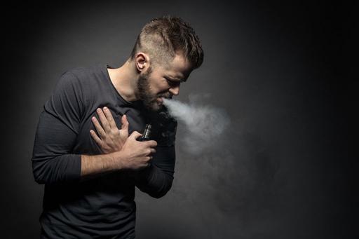 man in pain vaping