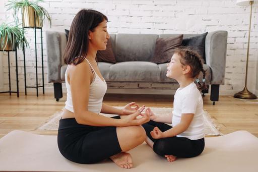 mum and daughter meditating