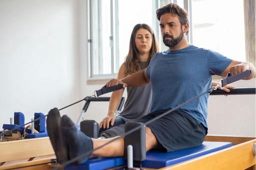 man in rehabilitation exercise with coach